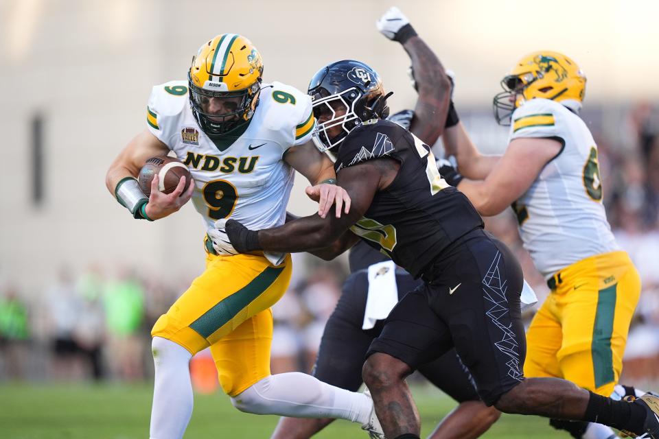 Aug 29, 2024; Boulder, Colorado, USA; Colorado Buffaloes linebacker LaVonta Bentley (20) tackles North Dakota State Bison quarterback Cole Payton (9) in the first half at Folsom Field. Mandatory Credit: Ron Chenoy-USA TODAY Sports