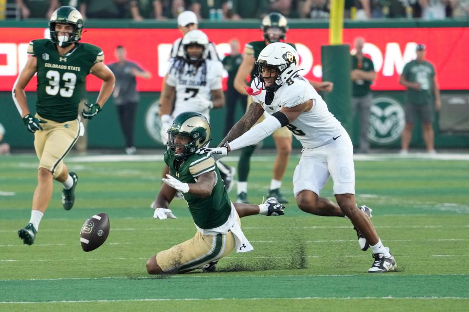 Sep 14, 2024; Fort Collins, Colorado, USA; Colorado Buffaloes cornerback DJ McKinney (8) defending against Colorado State Rams wide receiver Armani Winfield (1) at Sonny Lubick Field at Canvas Stadium. Mandatory Credit: Michael Madrid-Imagn Images