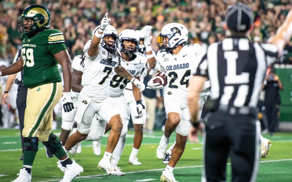 CU football defensive back Preston Hodge (24) celebrates with teammates after an interception against CSU in the Rocky Mountain Showdown at Canvas Stadium on Saturday, Sept. 14, 2024, in Fort Collins, Colo.