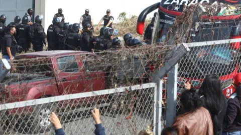 Getty Images National police officers transfer inmates from the Guayas 1 prison in response to an attempted prison riot in Guayaquil, Ecuador, on November 3, 2022.