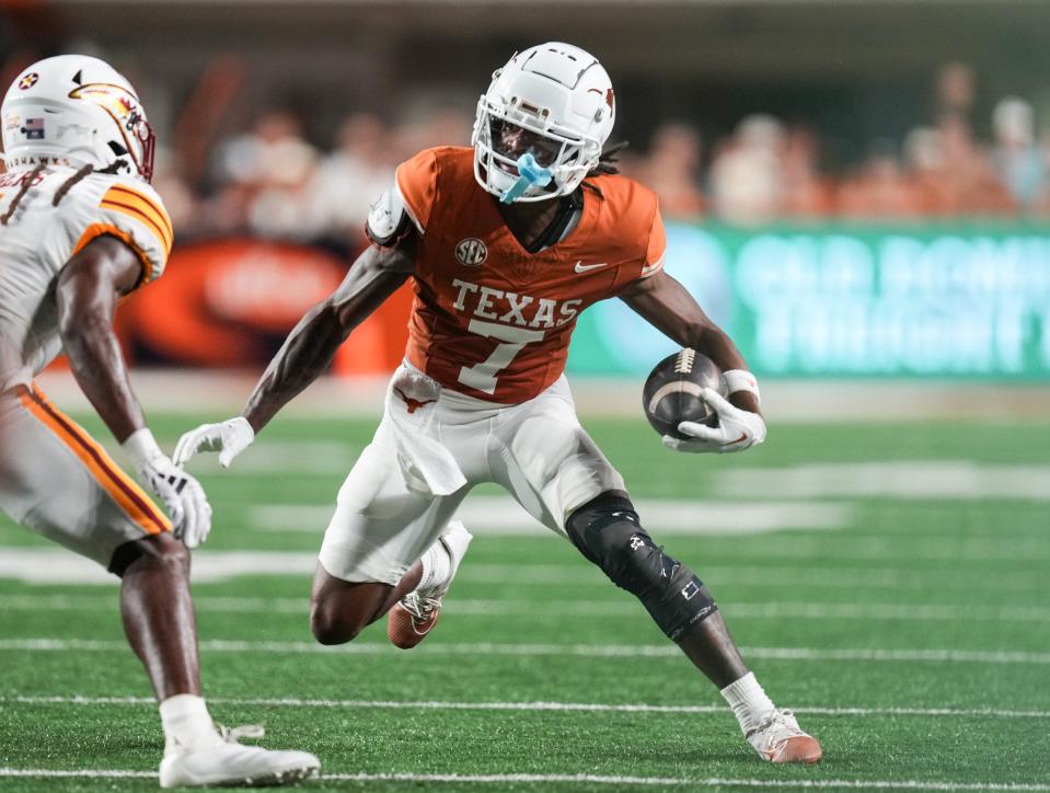 Texas Longhorns wide receiver Isaiah Bond (7) runs the ball forward as the Texas Longhorns take on ULM at Darrell K Royal-Texas Memorial Stadium in Austin Saturday, Sept. 21, 2024.