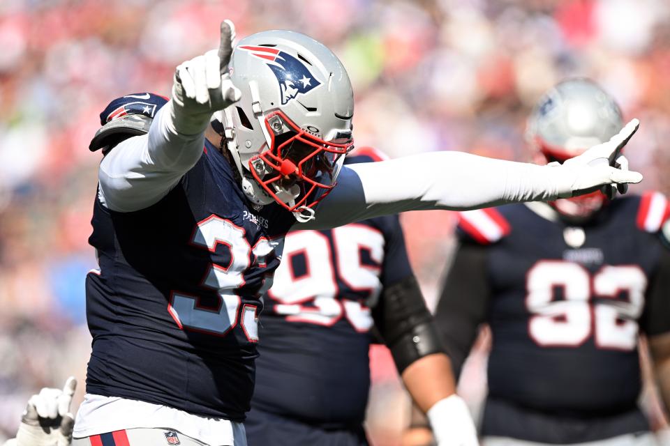 Sep 15, 2024; Foxborough, Massachusetts, USA; New England Patriots linebacker Anfernee Jennings (33) reacts after making a stop against the Seattle Seahawks during the second half at Gillette Stadium. Mandatory Credit: Brian Fluharty-Imagn Images