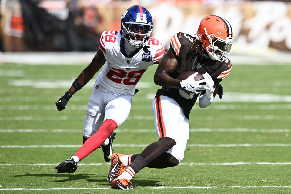 Sep 22, 2024; Cleveland, Ohio, USA; Cleveland Browns wide receiver Jerry Jeudy (3) runs with the ball after a catch as New York Giants cornerback Cor'Dale Flott (28) defends during the second half at Huntington Bank Field. Mandatory Credit: Ken Blaze-Imagn Images