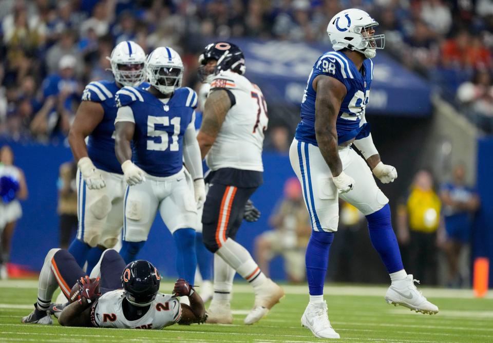 Indianapolis Colts defensive tackle Raekwon Davis (98) celebrates after making a stop Sunday, Sept. 22, 2024, during a game against the Chicago Bears at Lucas Oil Stadium in Indianapolis.