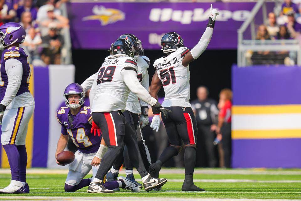 Sep 22, 2024; Minneapolis, Minnesota, USA; Houston Texans defensive end Will Anderson Jr. (51) celebrates his sack against the Minnesota Vikings quarterback Sam Darnold (14) in the second quarter at U.S. Bank Stadium. Mandatory Credit: Brad Rempel-Imagn Images