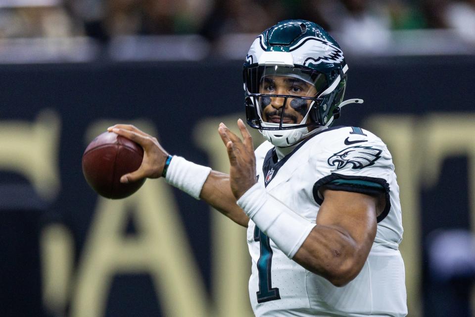 Sep 22, 2024; New Orleans, Louisiana, USA; Philadelphia Eagles quarterback Jalen Hurts (1) passes against the New Orleans Saints during the first half at Caesars Superdome. Mandatory Credit: Stephen Lew-Imagn Images