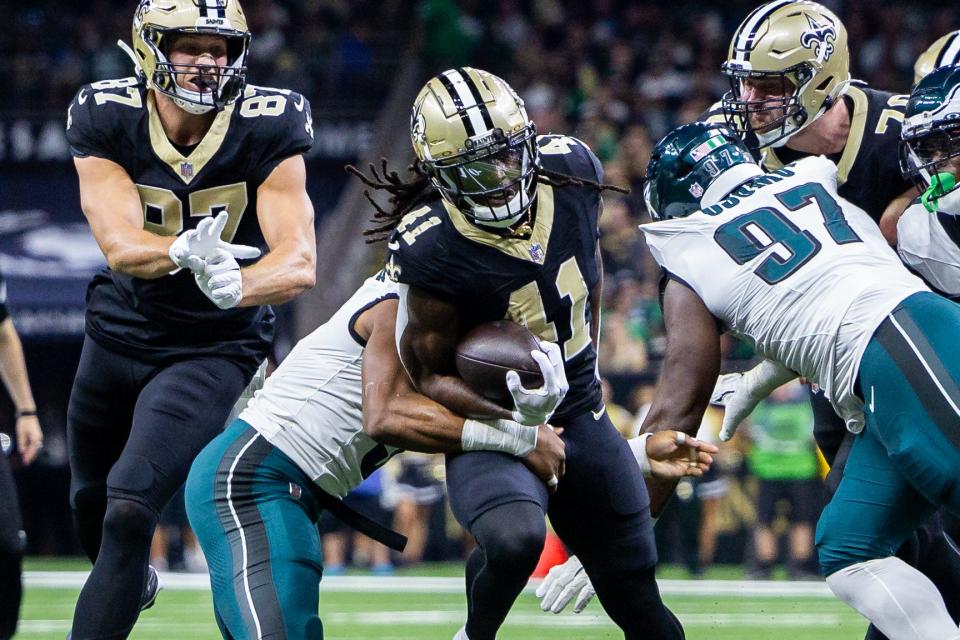 Sep 22, 2024; New Orleans, Louisiana, USA; New Orleans Saints running back Alvin Kamara (41) is tackled by Philadelphia Eagles linebacker Nolan Smith Jr. (3) during the first half at Caesars Superdome. Mandatory Credit: Stephen Lew-Imagn Images