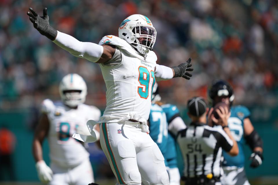 Sep 8, 2024; Miami Gardens, Florida, USA; Miami Dolphins defensive tackle Da'Shawn Hand (91) celebrates a sack of Jacksonville Jaguars quarterback Trevor Lawrence (16) during the fourth quarter at Hard Rock Stadium. Mandatory Credit: Jim Rassol-Imagn Images