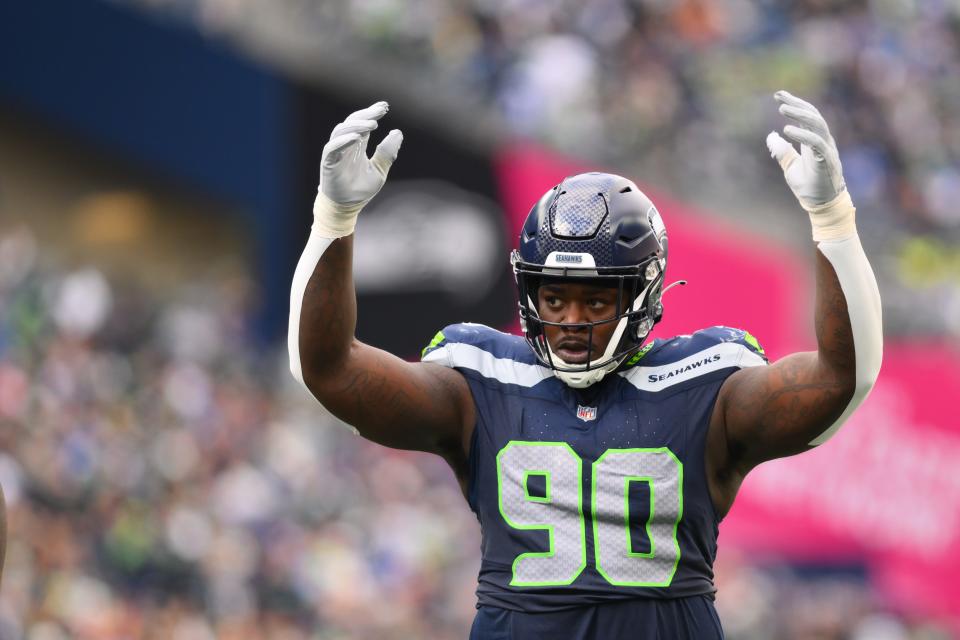 Oct 22, 2023; Seattle, Washington, USA; Seattle Seahawks defensive tackle Jarran Reed (90) interacts with the fans during the second half against the Arizona Cardinals at Lumen Field. Mandatory Credit: Steven Bisig-USA TODAY Sports