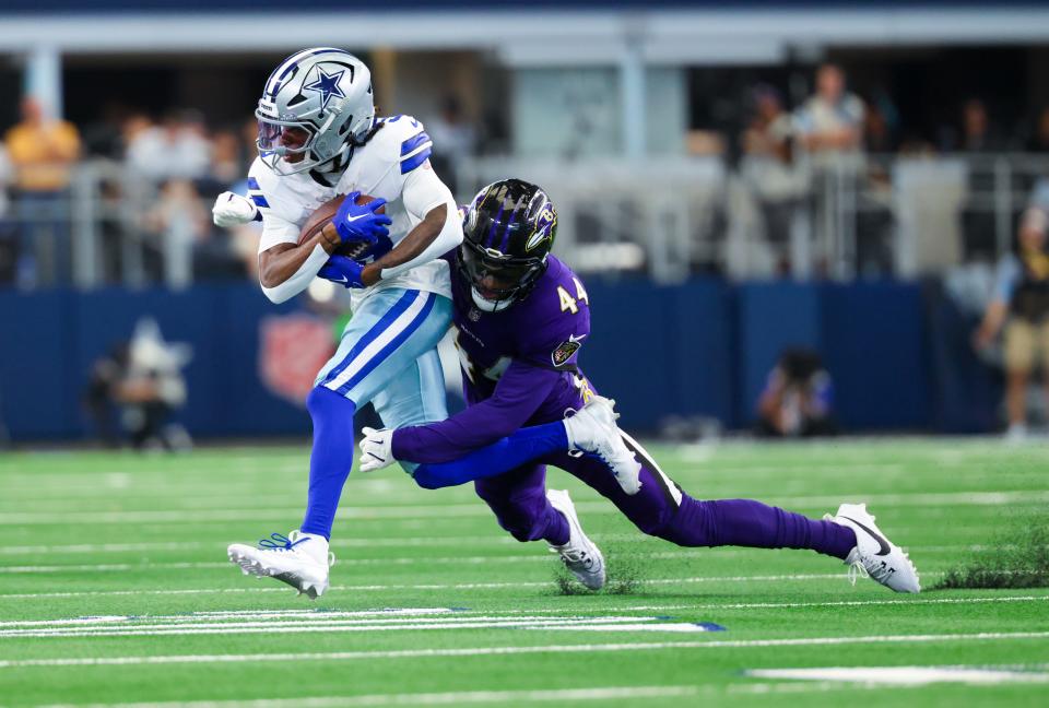 Sep 22, 2024; Arlington, Texas, USA; Dallas Cowboys wide receiver KaVontae Turpin (9) is tackled by Baltimore Ravens cornerback Marlon Humphrey (44) during the first half at AT&T Stadium. Mandatory Credit: Kevin Jairaj-Imagn Images