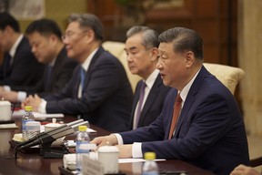 Chinese President Xi Jinping, right, and his delegation attends a meeting with Italian Premier Giorgia Meloni (not seen) at the Diaoyutai State Guesthouse on July 29, 2024 in Beijing, China