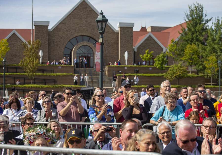 A large crowd watches as Slovak Republic President Peter Pellegrini speaks about what the new clock tower means to the Slovak Republic and Iowa during the dedication of the Buresh Immigration Clock Tower in Czech Village in Cedar Rapids on Friday. (Savannah Blake/The Gazette)