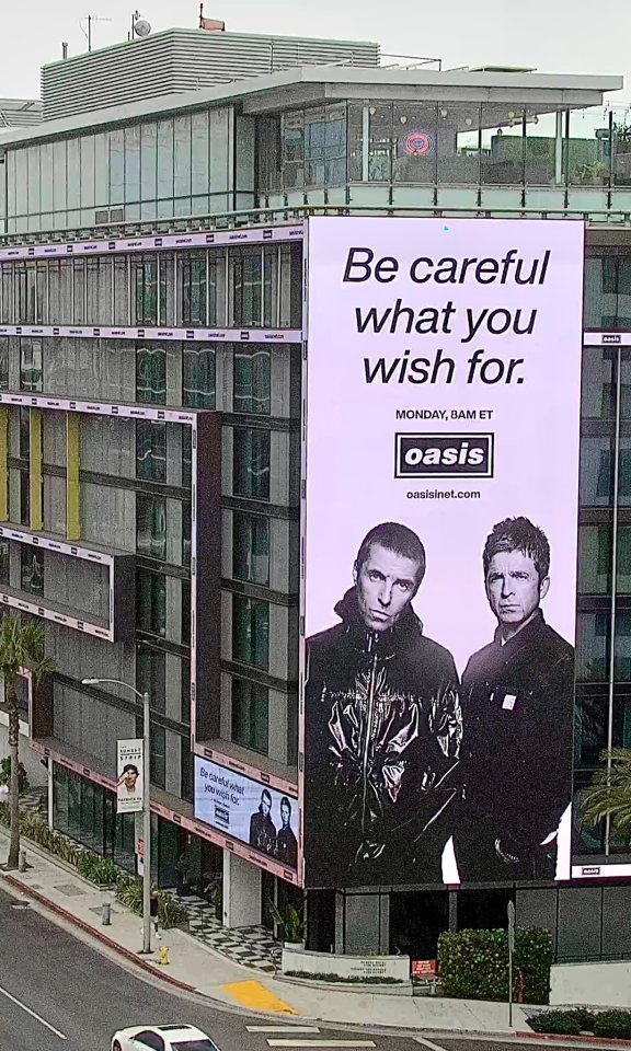 They shared four photographs of billboards of the band in major North American cities