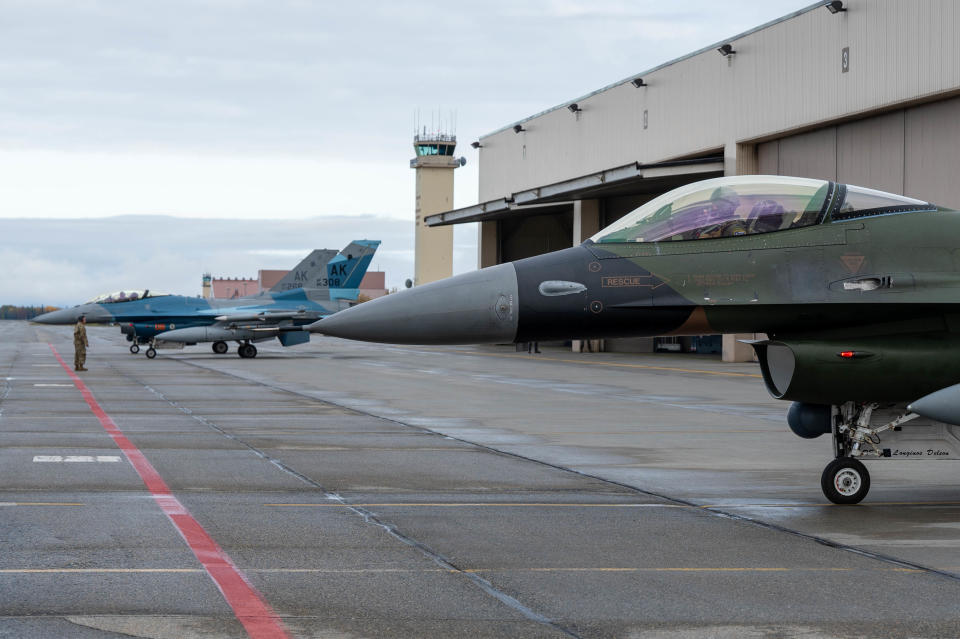 North American Aerospace Defense Command F-16 Fighting Falcons pilots conduct final checks on September 11, 2024 before departing Eielson Air Force Base, Alaska. The F-16’s supported OPERATION POLAR VORTEX and provided integration training with Navy assets in the Alaska Theater of Operations. Continuing our presence in the Arctic through training and operations demonstrates how NORAD and U.S. Northern Command campaign daily in coordination with mission partners to deter aggression; enhance deterrence, stability and resilience; advance capabilities and posture; and detect and respond to threats in support of the layered defense of our nations. (U.S. Air Force photo by Airman 1st Class Carson Jeney)