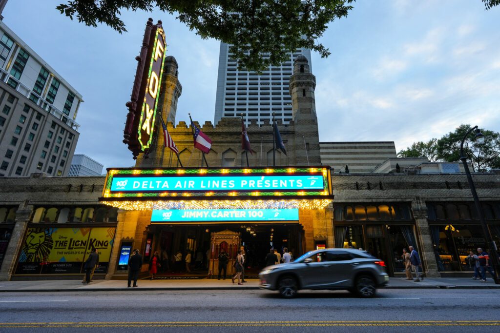 People wait in line ahead of a "Jimmy Carter 100: A Celebration in Song," concert at the Fox Theatr...