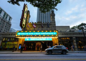 People wait in line ahead of a "Jimmy Carter 100: A Celebration in Song," concert at the Fox Theatr...