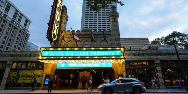 People wait in line ahead of a "Jimmy Carter 100: A Celebration in Song," concert at the Fox Theatr...