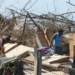 Getty Images Two women look through the remains of a house destroyed by Hurricane Dorian in Great Abaco Island, Bahamas, 5 September
