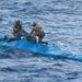 Personnel on top of the narco-submarine, from which HMS Trent seized cocaine. Credit: UK Royal Navy