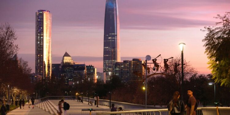 Couples walk along the esplanade of the Bicentennial Park in the commune of Vitacura in Santiago on September 5, 2024.