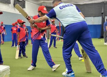 A man wearing a tshirt that says