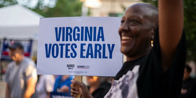 a voter works on his ballot at a polling station at the elena bozeman government centre in arlington virginia on september 20 2024 early in person voting for the 2024 us presidential election began in virginia south dakota and minnesota photo afp