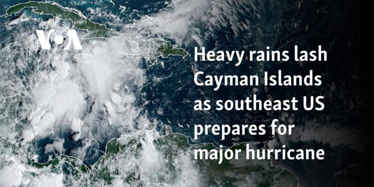 Heavy rains lash Cayman Islands as southeast US prepares for major hurricane 
