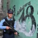 Getty Images Members of the National Police patrol in Colonia Divanna, Barrio 18 gang territory, in Tegucigalpa on March 17, 2023