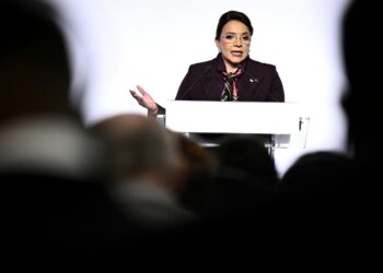 Honduras' president is asked to resign after corruption scandal she says is a plot to oust her