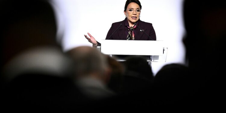 Honduras' president is asked to resign after corruption scandal she says is a plot to oust her