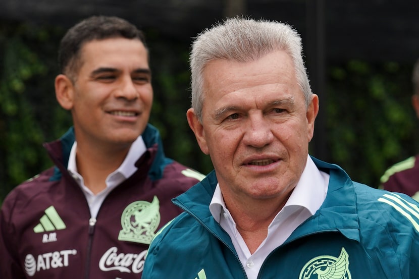 Mexico's new national football team coach Javier Aguirre, right, and his assistant, former...