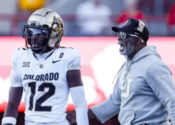 Colorado Buffaloes head coach Deion Sanders walks on to the field to talk with Colorado Buffaloes Travis Hunter 12 in action during a NCAA, College League, USA Division 1 football game between Colorado Buffalos and the Nebraska Cornhuskers at Memorial Stadium in Lincoln, NE.
