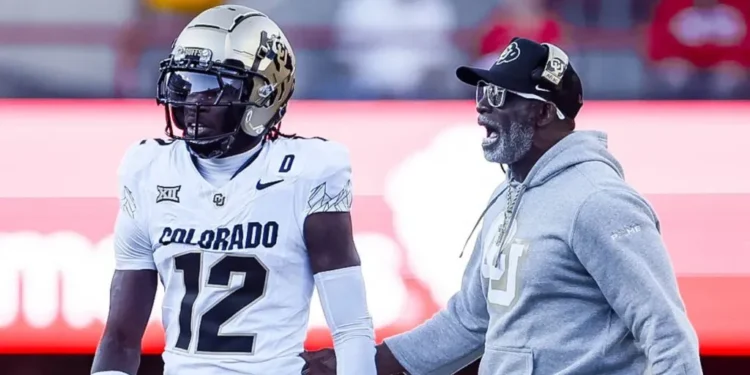 Colorado Buffaloes head coach Deion Sanders walks on to the field to talk with Colorado Buffaloes Travis Hunter 12 in action during a NCAA, College League, USA Division 1 football game between Colorado Buffalos and the Nebraska Cornhuskers at Memorial Stadium in Lincoln, NE.