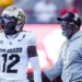 Colorado Buffaloes head coach Deion Sanders walks on to the field to talk with Colorado Buffaloes Travis Hunter 12 in action during a NCAA, College League, USA Division 1 football game between Colorado Buffalos and the Nebraska Cornhuskers at Memorial Stadium in Lincoln, NE.