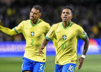 Rodrygo Goes, wearing yellow and green Brazilian football jersey, celebrates after scoring the first goal of the match during the FIFA World Cup 2026 Qualifier, ahead of the Paraguay vs Brazil live stream