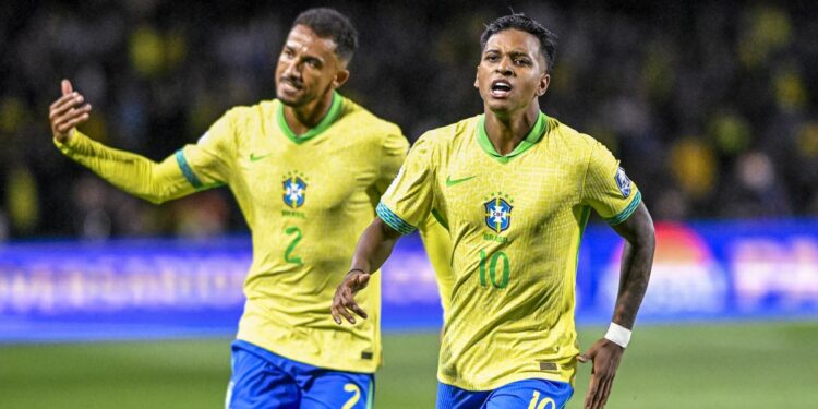 Rodrygo Goes, wearing yellow and green Brazilian football jersey, celebrates after scoring the first goal of the match during the FIFA World Cup 2026 Qualifier, ahead of the Paraguay vs Brazil live stream