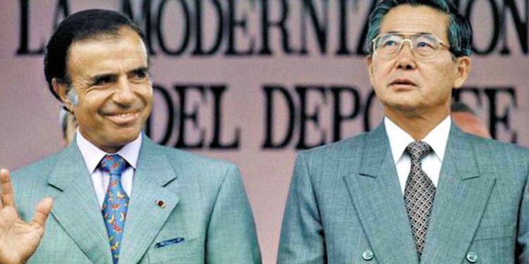 Argentina's then-president Carlos Menem poses for a photograph with Peru's then-president Alberto Fujimori.