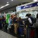 stranded passengers wait in line at the aerolineas argentinas customers service office at the aeroparque jorge newbery airport during an aviation unions strike in buenos aires on sept 13 2024 photo reuters
