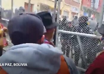 Police fire teargas during clashes with protesters in Bolivia as economic crisis deepens
