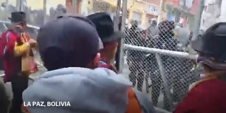 Police fire teargas during clashes with protesters in Bolivia as economic crisis deepens