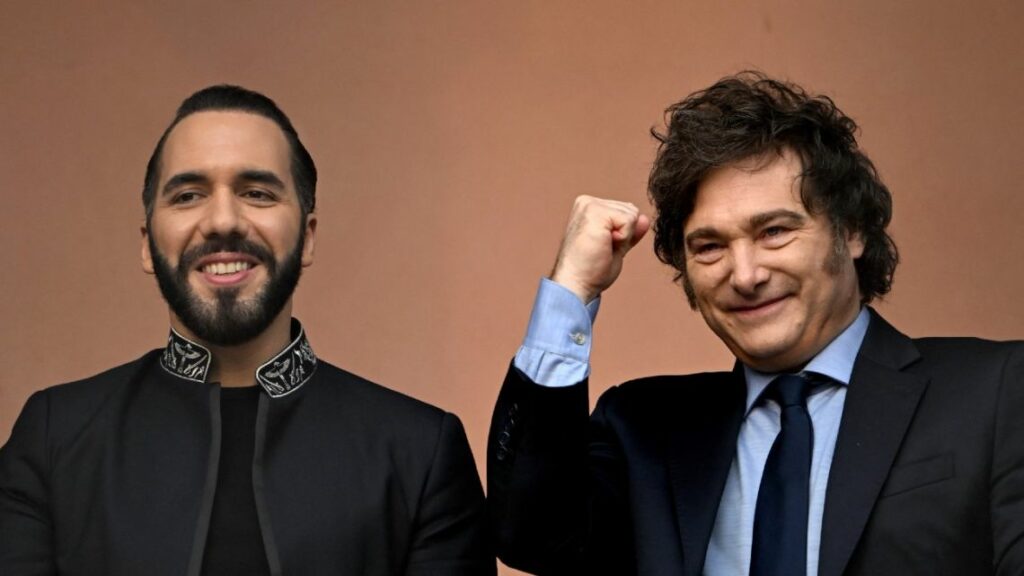 Argentina's President Javier Milei gestures next to El Salvador's President Nayib Bukele on the balcony of the Casa Rosada presidential palace in Buenos Aires on September 30, 2024.