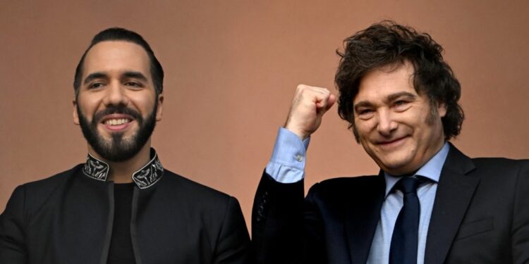 Argentina's President Javier Milei gestures next to El Salvador's President Nayib Bukele on the balcony of the Casa Rosada presidential palace in Buenos Aires on September 30, 2024.