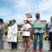 Supporters hold signs at a rally organized by the New Sanctuary Movement in support of Haitian immigrants outside of the National Constitution Center in Philadelphia on Thursday, Sept. 19, 2024.