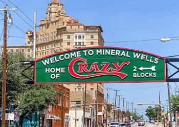Visit Mineral Wells Sign saying Welcome to Mineral Wells, Home of Crazy (Credit: Visit Mineral Wells)
