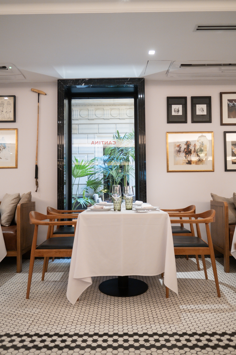 a dining room with a table and chairs