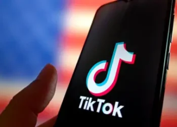 Getty Images TikTok's logo displayed on a smartphone with the US flag in the background