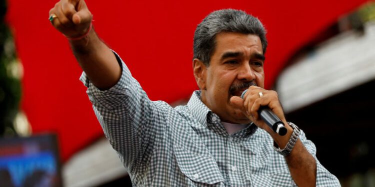 FILE PHOTO: Venezuelan President Nicolas Maduro delivers a speech