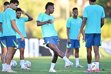 Brazil's forward Vinicius Junior passes the ball during a training session 