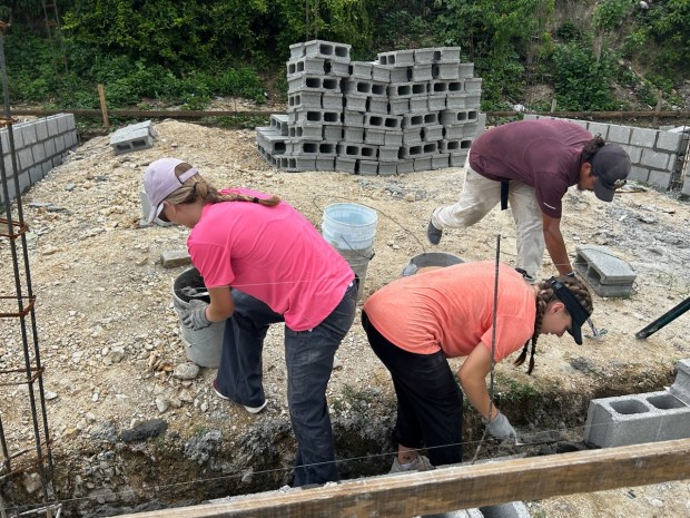 Avery and Sydney Rick spent one week this summer helping...