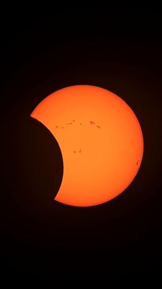 the sun is becoming increasingly eclipsed by the moon during the annular solar eclipse